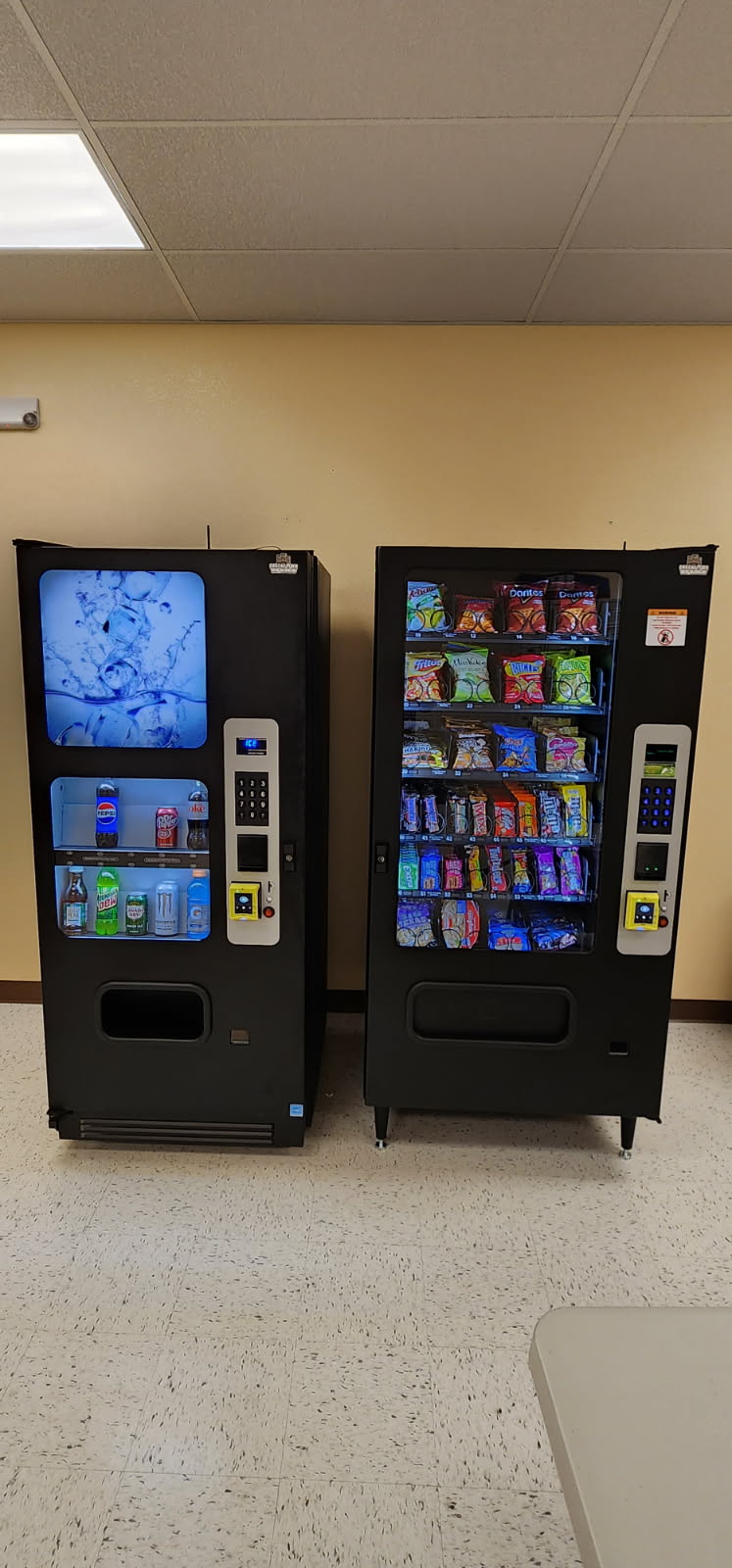 Two vending machines in a break room